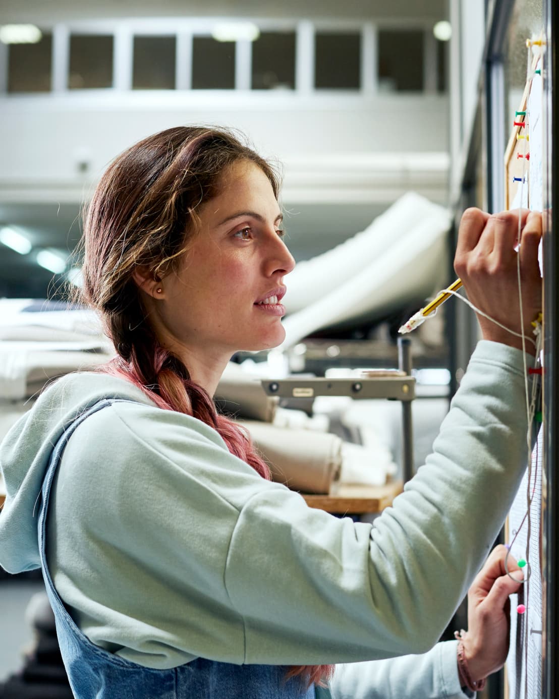 Woman writing on bulletin board