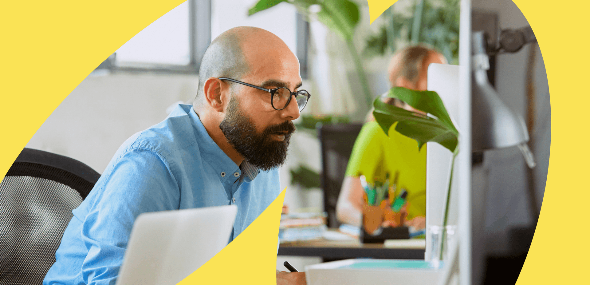 Man at desk in office setting